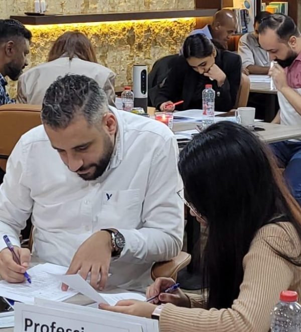 Delegates working through a written exercise at the Aquaness Technical Institute
