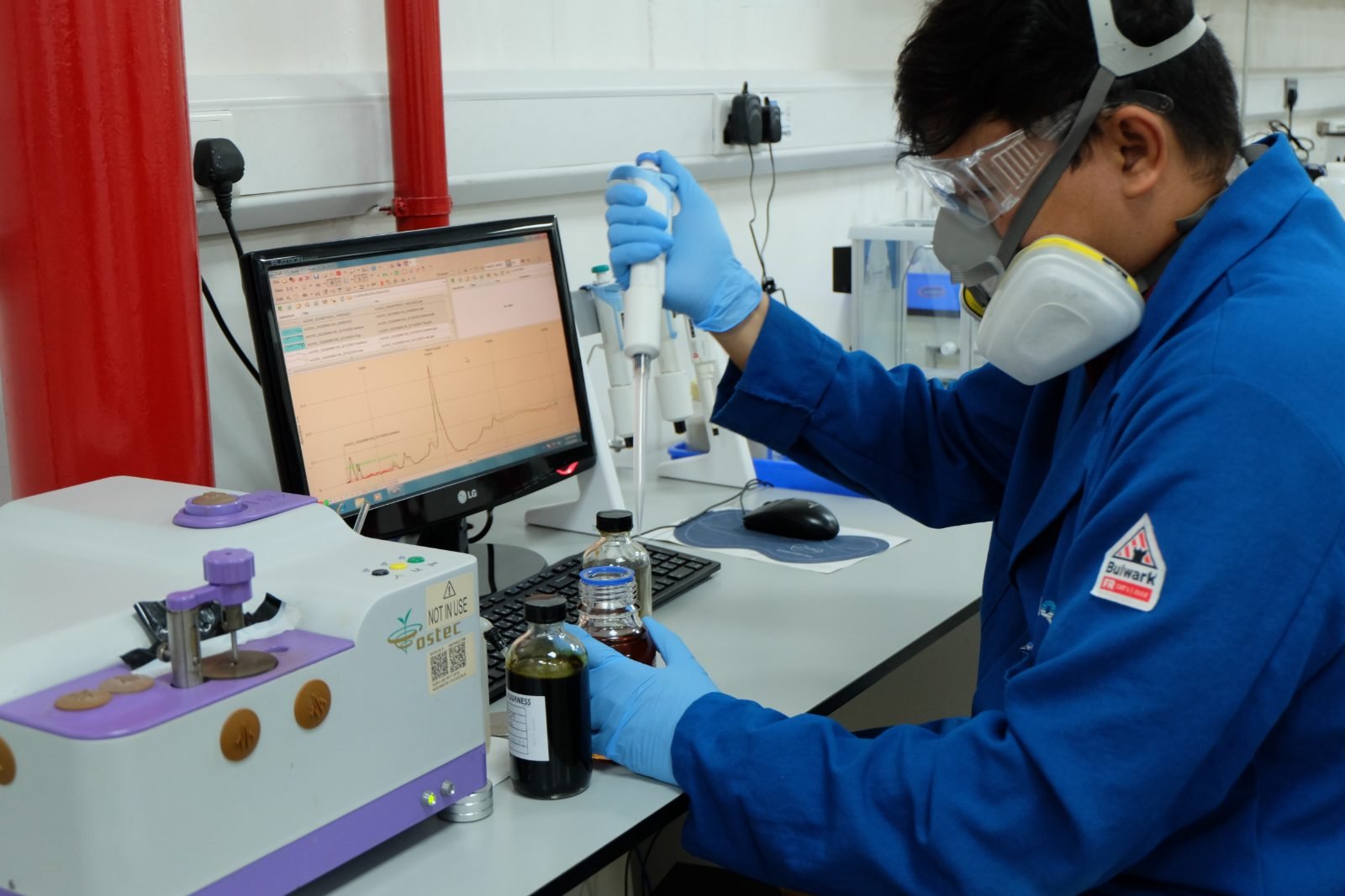 Analyst running a bench test in the Dubai laboratory