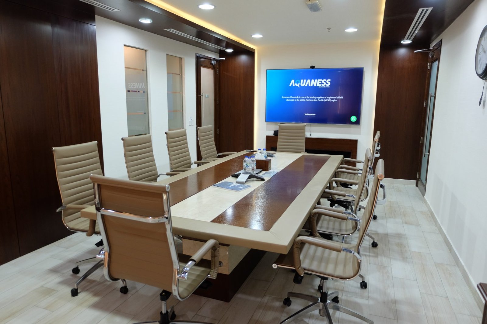 The senior management meeting room, screen at the head of the table