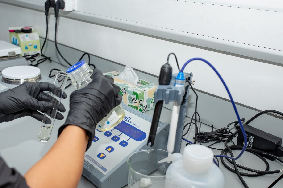 A chemist taking a reading at the laboratory bench